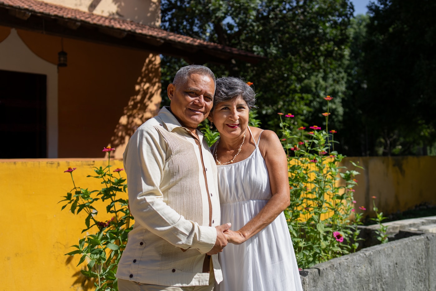 Adults aged 40 to 65 in front of a French residential building
